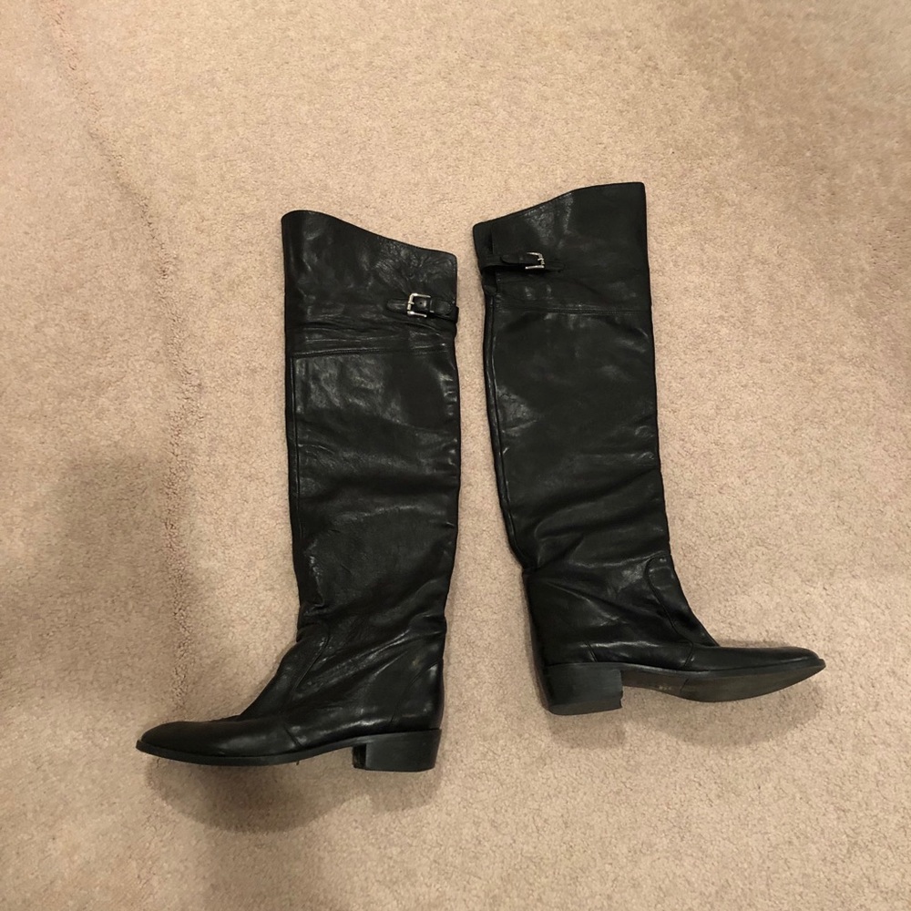 Above the knee black leather boots
